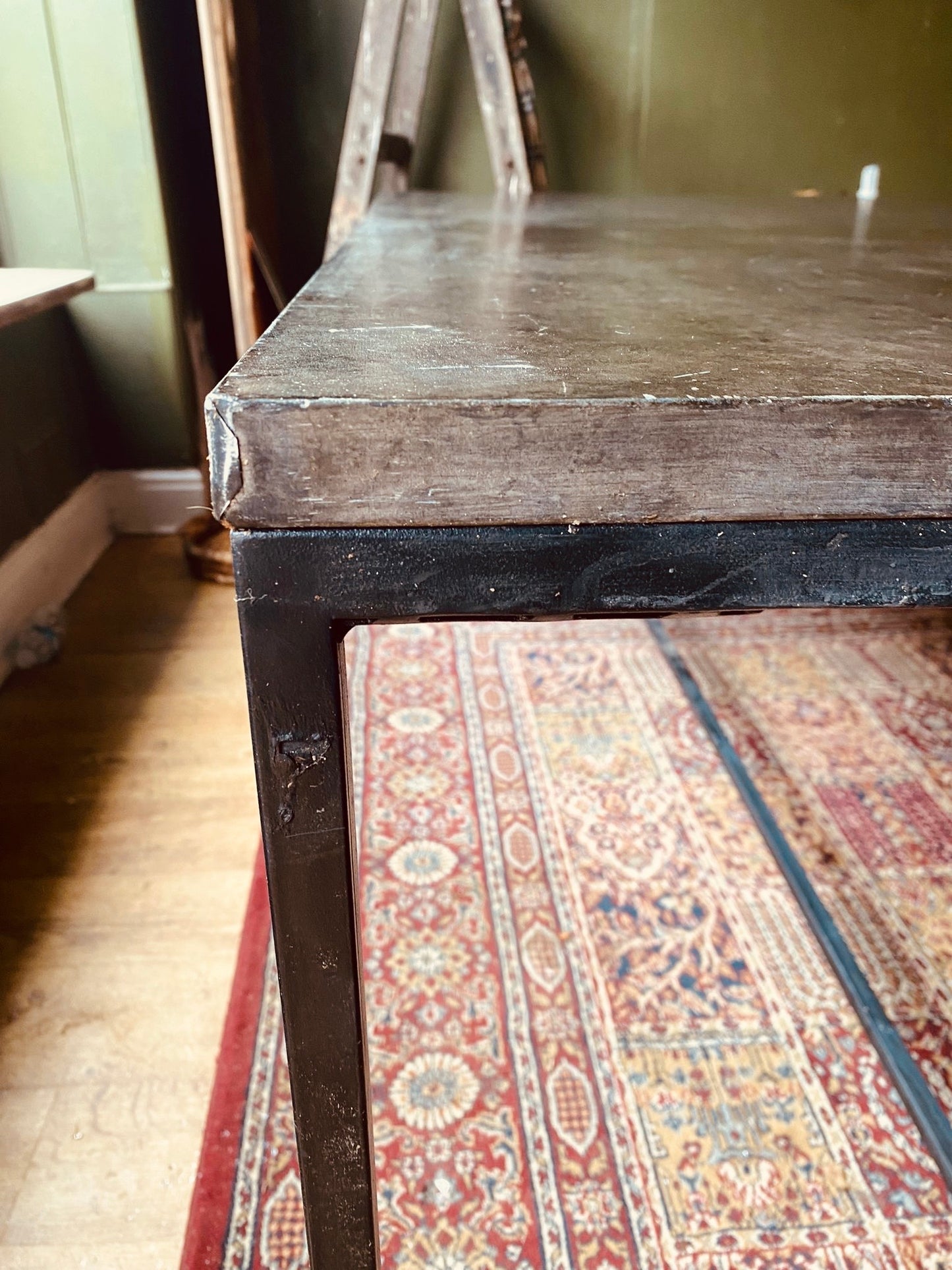 Industrial Metal Dining Table – Vintage Steel Top on Minimal Iron Frame