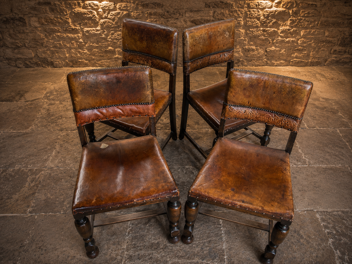 Antique Set of Four Embossed Leather & Oak Dining Chairs | Tudor Revival | Circa 1920s
