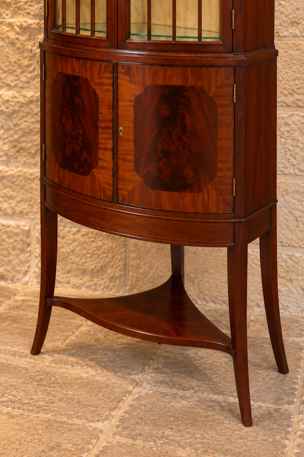Mahogany bow-front corner display cabinet