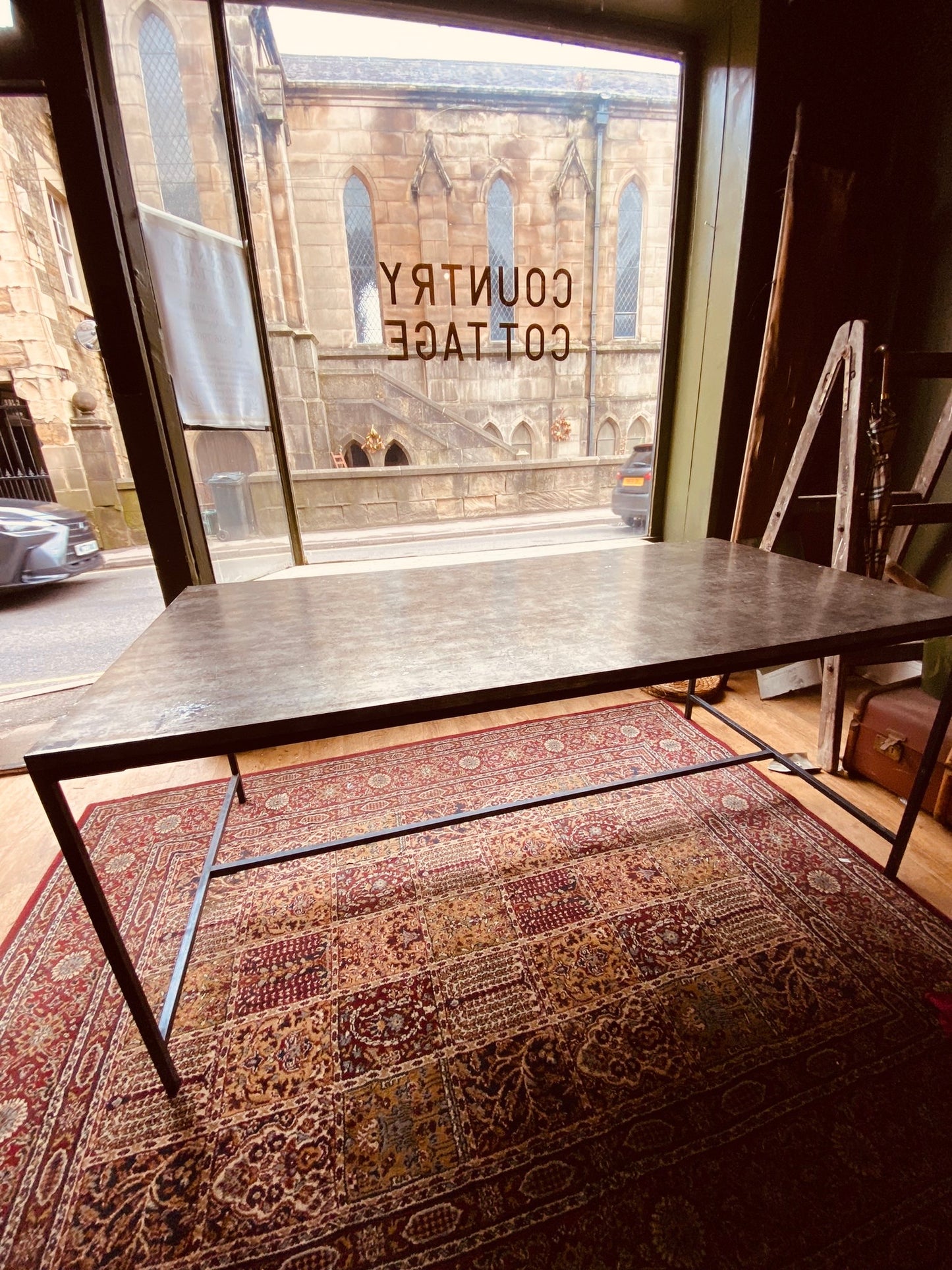Industrial Metal Dining Table – Vintage Steel Top on Minimal Iron Frame