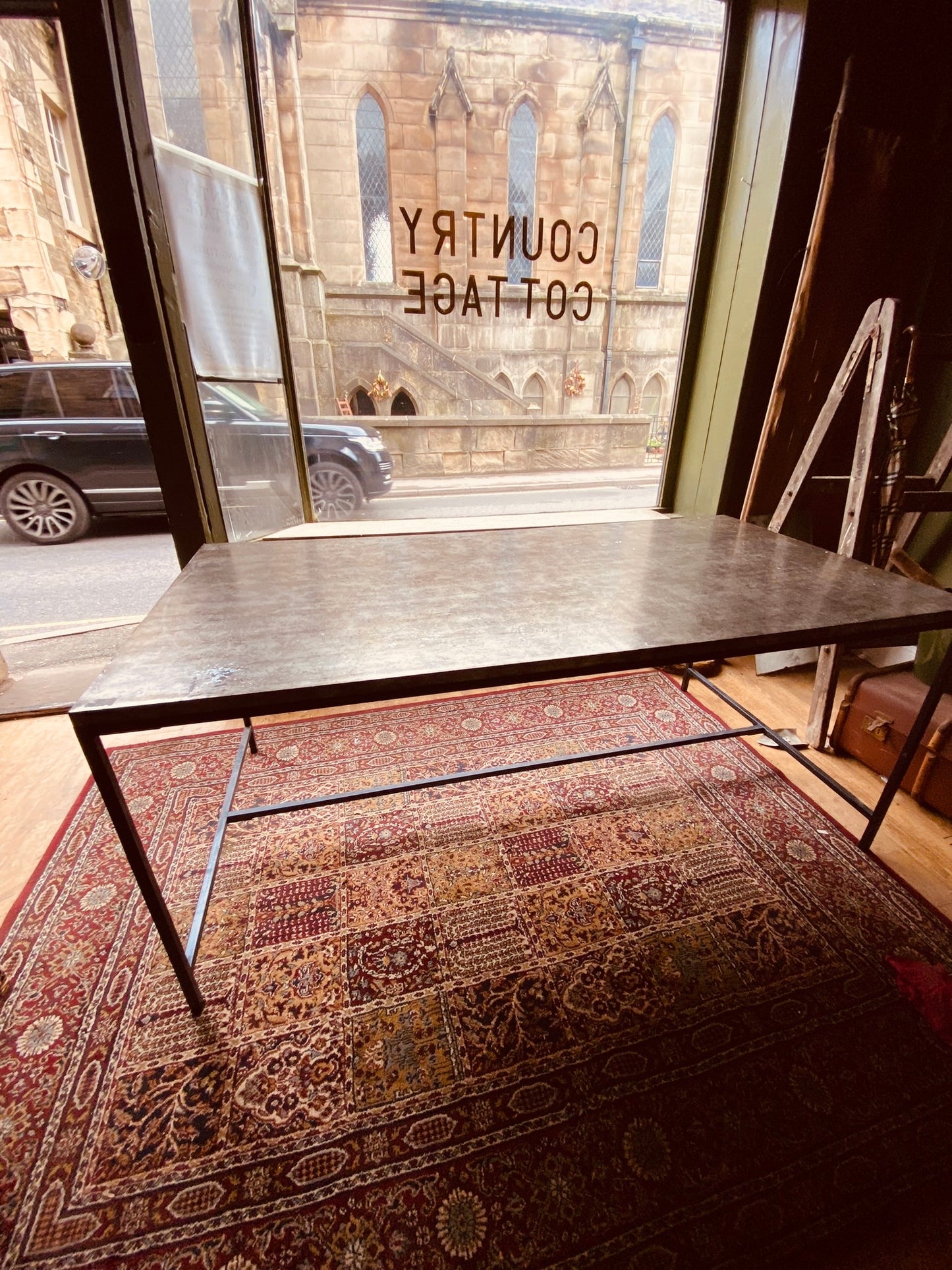 Industrial Metal Dining Table – Vintage Steel Top on Minimal Iron Frame