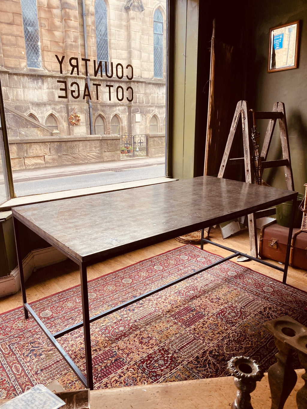 Industrial Metal Dining Table – Vintage Steel Top on Minimal Iron Frame