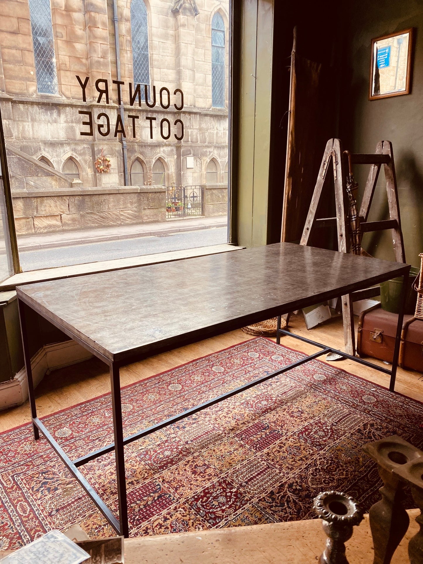 Industrial Metal Dining Table – Vintage Steel Top on Minimal Iron Frame